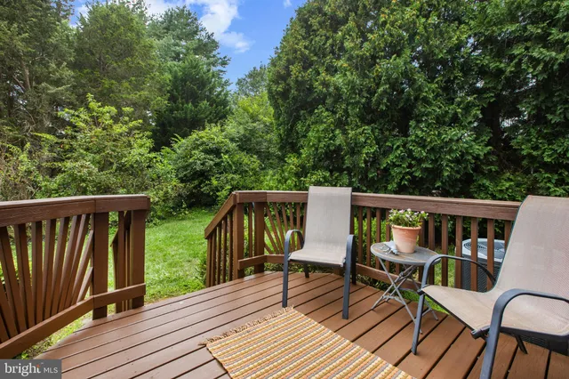 a front view of a house with outdoor seating