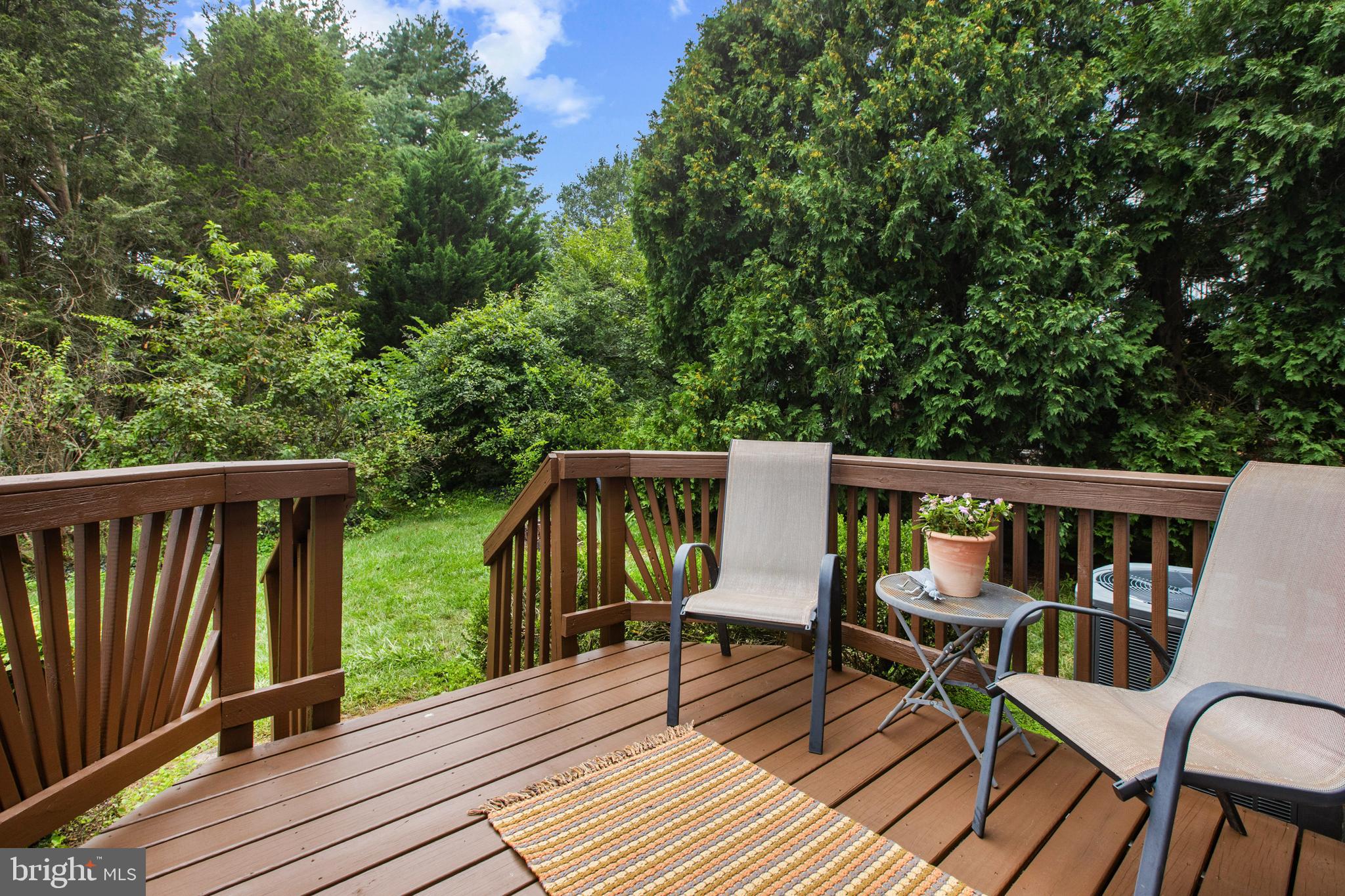 741 Burgh Westra Way Abingdon, MD 21009 - Photo 41 of 48 a balcony with wooden floor outdoor seating and yard in the back