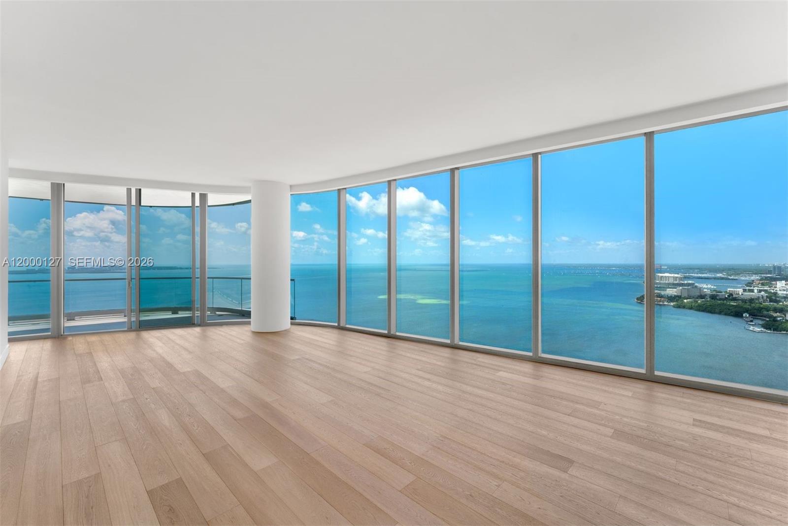175 Southeast 25th Road, Unit 3602 Miami, FL 33129 - Photo 22 of 25 wooden floor in an empty room with a large window
