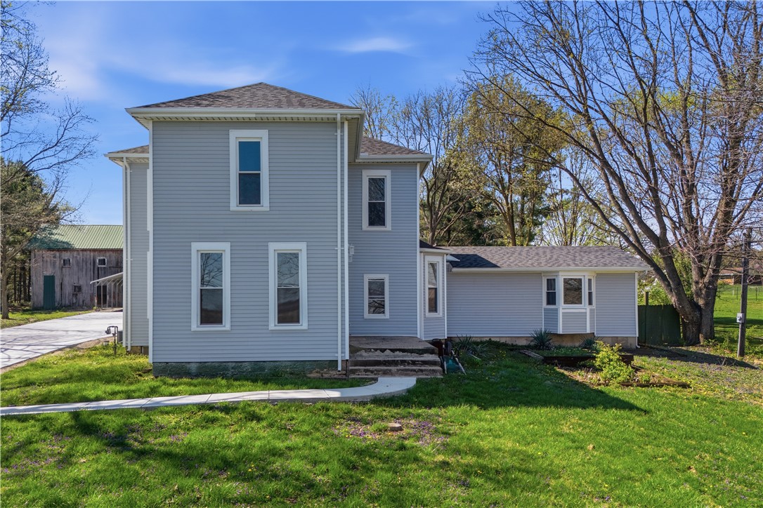 3190 Rebert Pike Springfield, OH 45502 - Photo 1 of 48 This charming residence features classic siding and a lush lawn, presenting a welcoming facade.