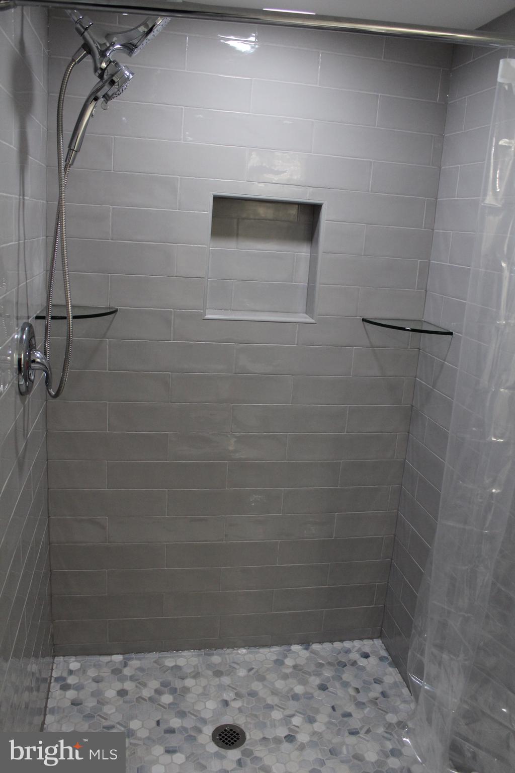 7703 Newcastle Drive Annandale, VA 22003 - Photo 7 of 12 a bathroom with a shower