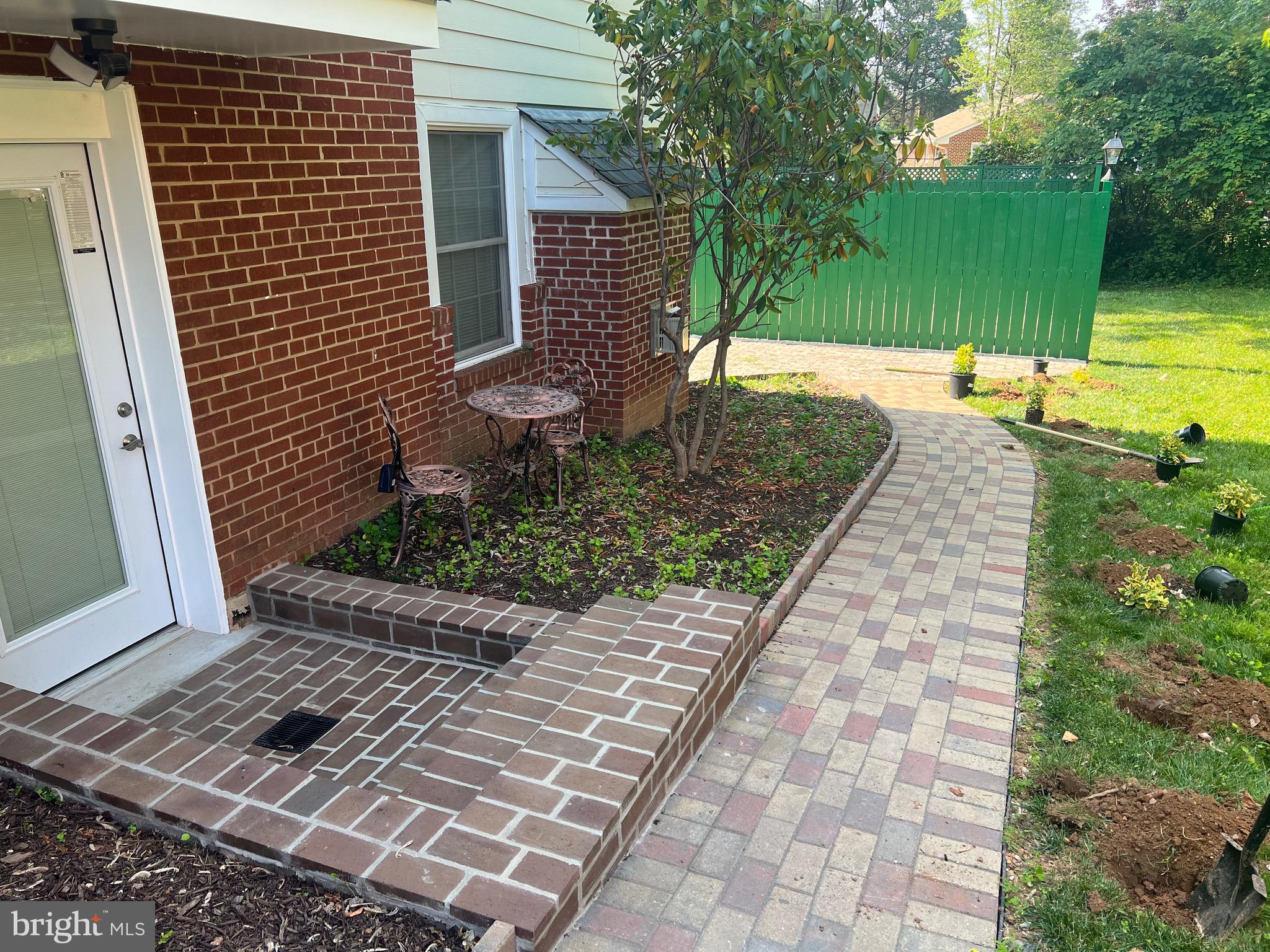 7703 Newcastle Drive Annandale, VA 22003 - Photo 9 of 12 a view of a backyard with sitting area