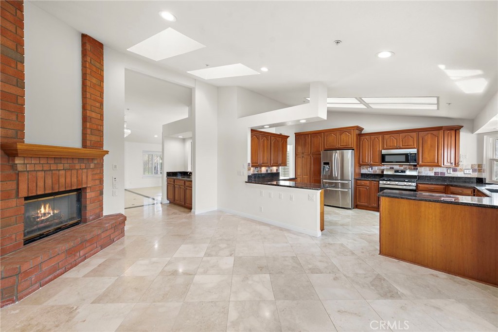 2847 Calle Heraldo San Clemente, CA 92673 - Photo 7 of 16 View from the patio looking towards the living room with its cozy fireplace.