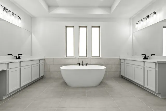 a bathroom with a bathtub a sink a mirror and a window