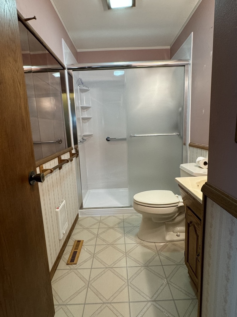 7912 Elm Street Harvard, IL 60033 - Photo 13 of 37 a bathroom with a toilet and a shower