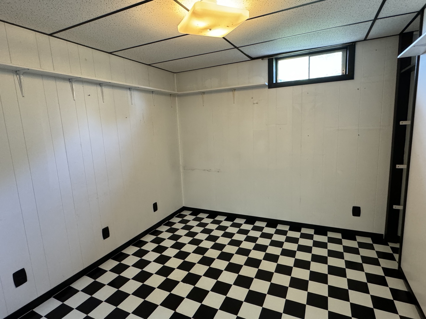 7912 Elm Street Harvard, IL 60033 - Photo 22 of 37 a view of a black and white checkered floor