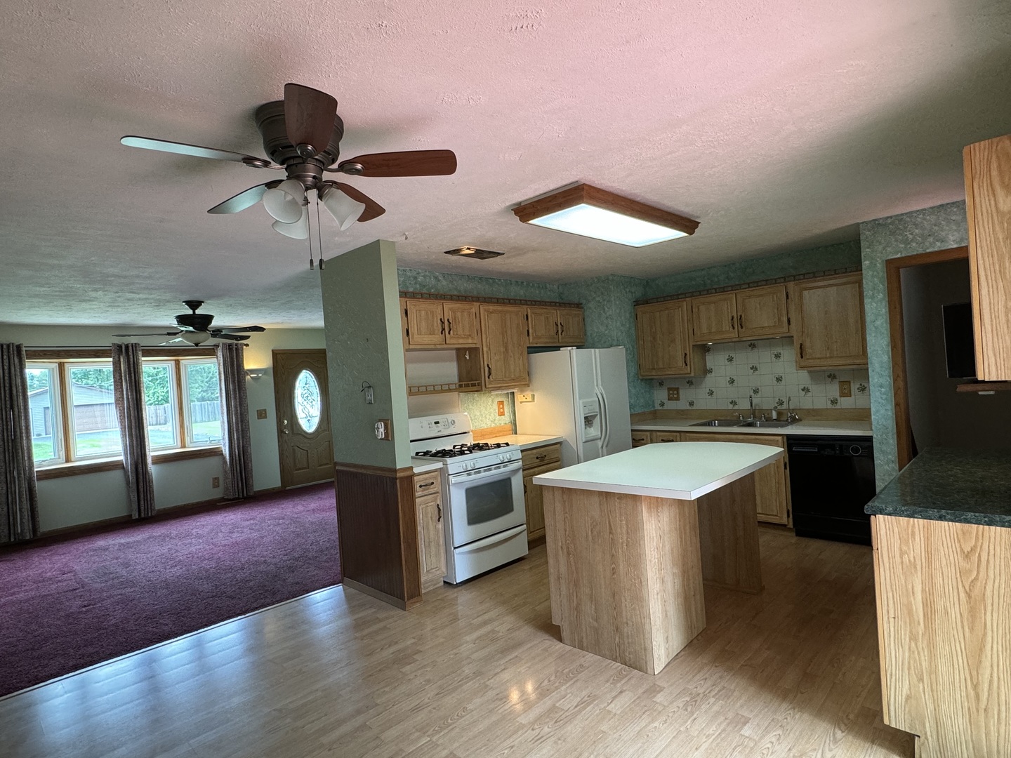 7912 Elm Street Harvard, IL 60033 - Photo 37 of 37 a kitchen with stainless steel appliances granite countertop a sink and a stove