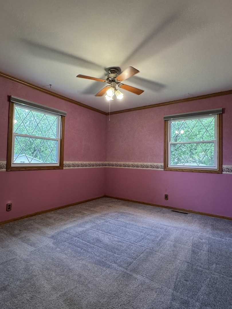 7912 Elm Street Harvard, IL 60033 - Photo 9 of 37 an empty room with windows