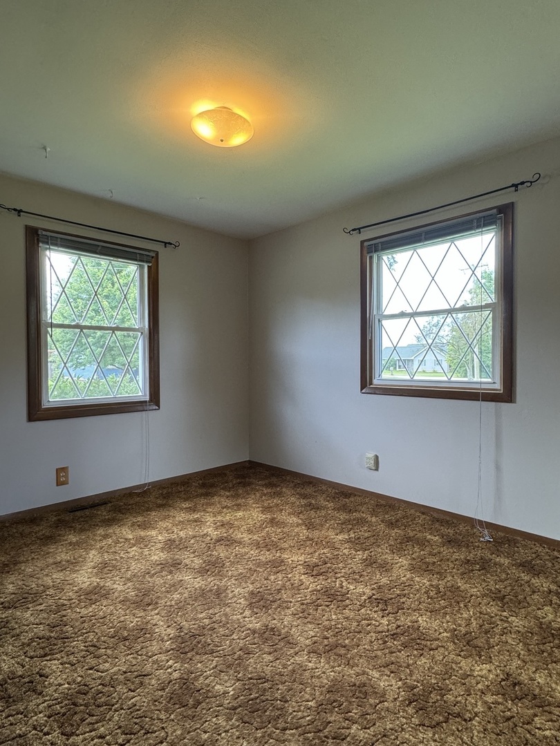 7912 Elm Street Harvard, IL 60033 - Photo 10 of 37 an empty room with windows
