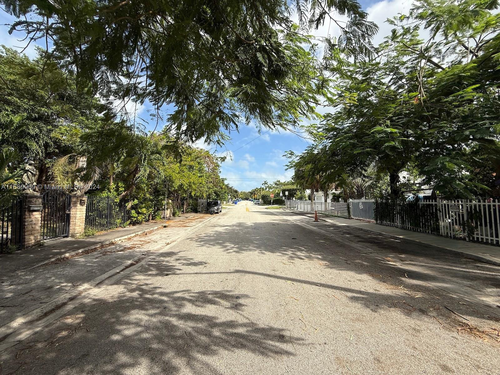 127 Northwest 47th Street Miami, FL 33127 - Photo 4 of 7 a view of road with with trees