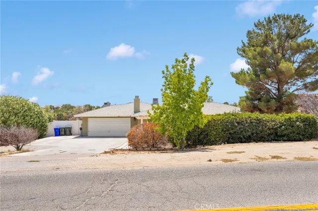 a view of a house with a street