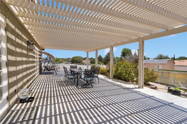 a view of a swimming pool with a patio