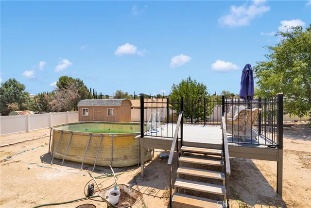 a view of a terrace with wooden floor and seating space