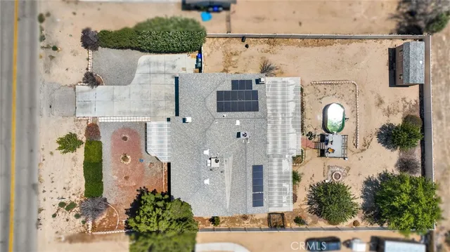an aerial view of a house with outdoor space