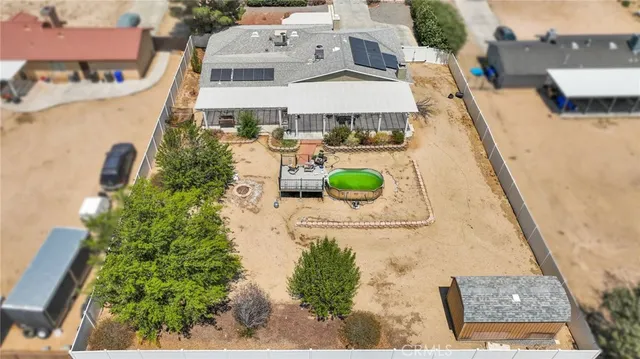 an aerial view of a house with a swimming pool