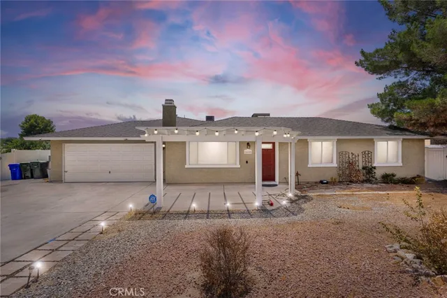a front view of a house with sitting area
