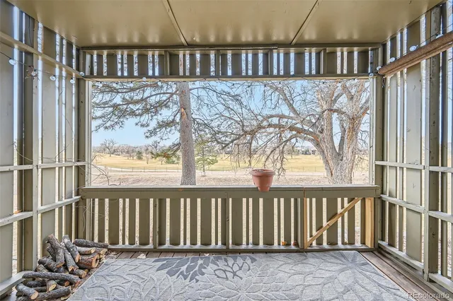 a view of a balcony with wooden floor