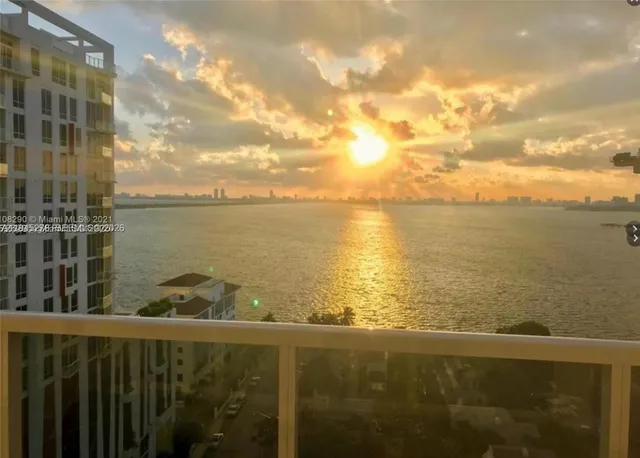 a view of a lake from a balcony