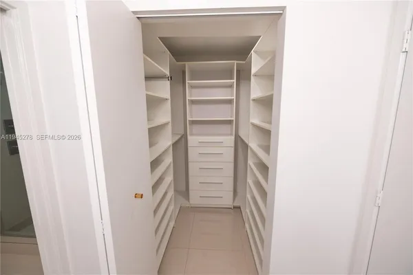 a bathroom with a sink toilet and mirror