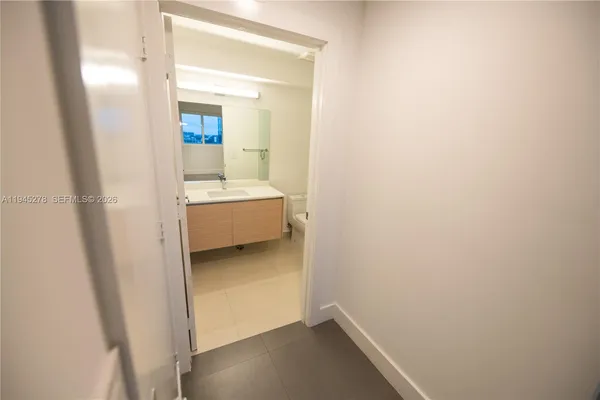 a kitchen with a sink and natural light