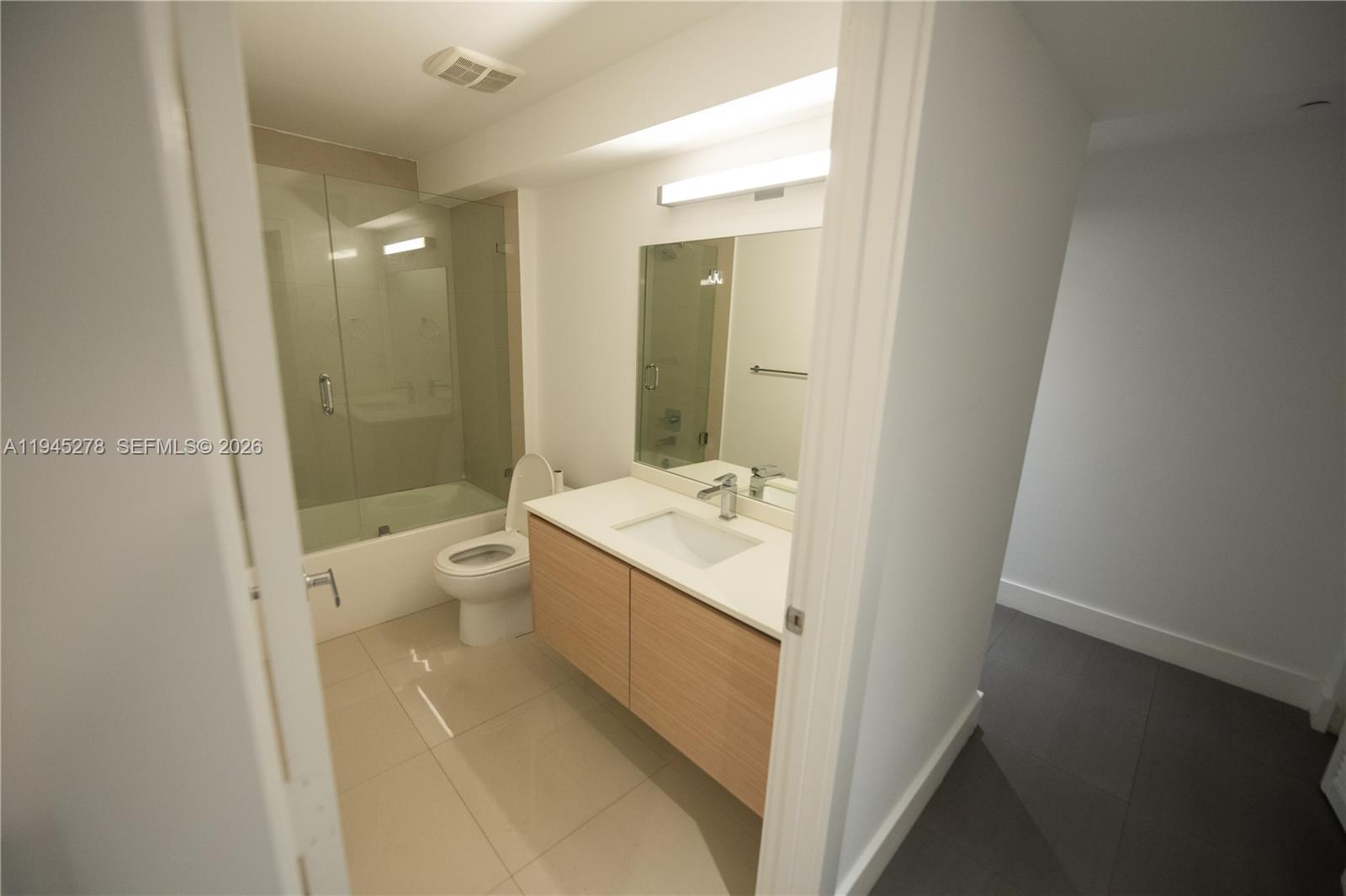 600 Northeast 27th Street, Unit 1602 Miami, FL 33137 - Photo 27 of 34 a bathroom with a sink a toilet and shower