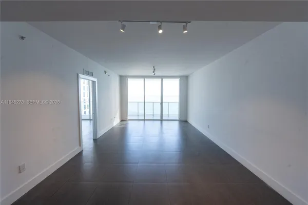 a view of a hallway with windows