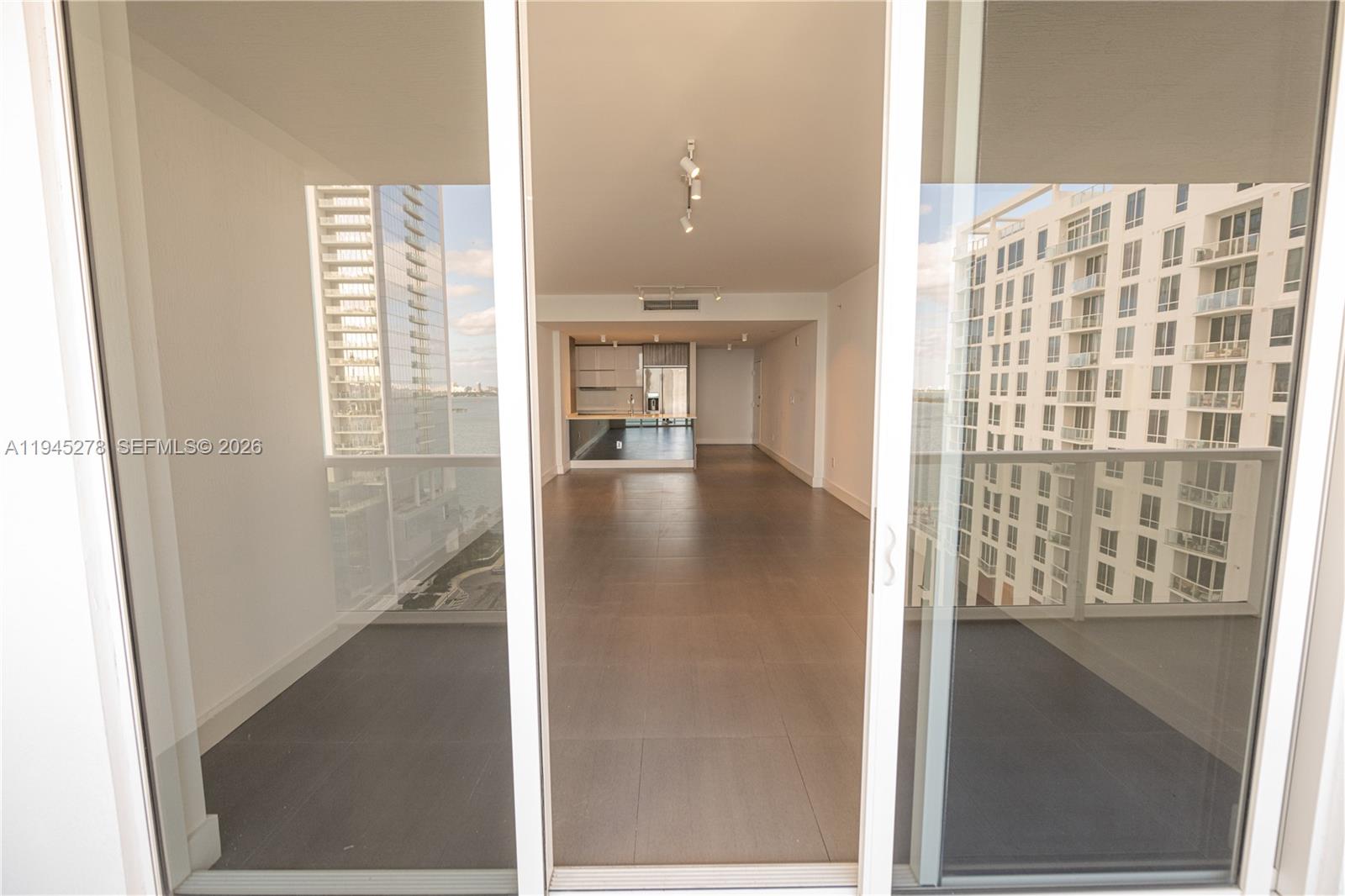 600 Northeast 27th Street, Unit 1602 Miami, FL 33137 - Photo 9 of 34 a view of a hallway with windows