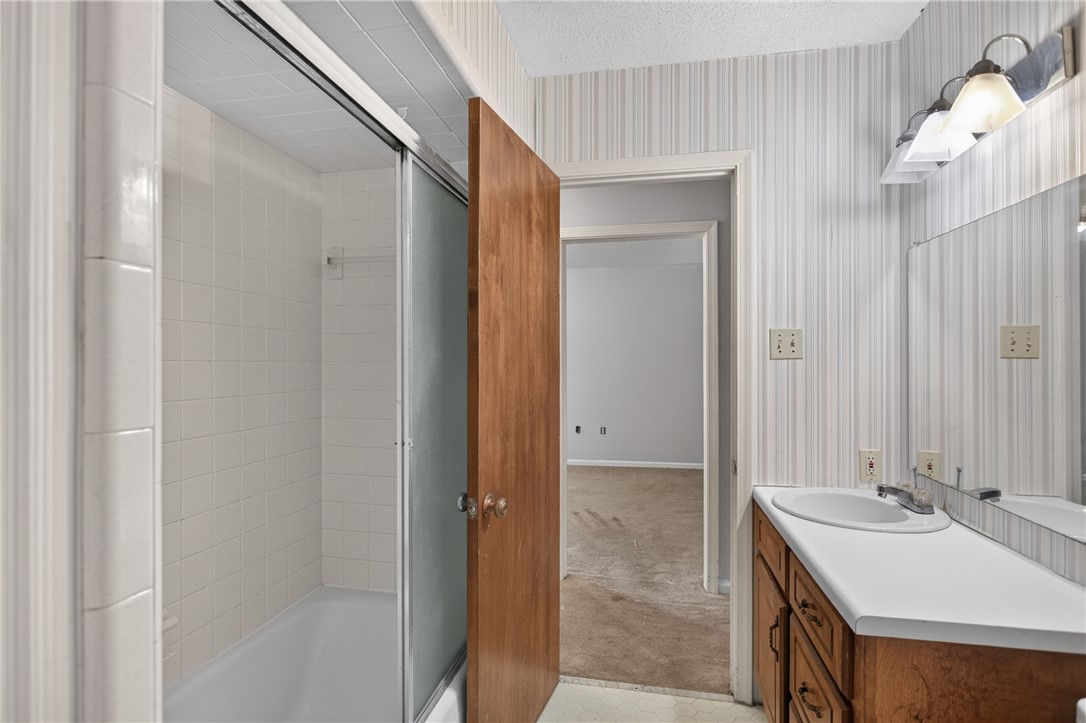 1412 Simpson Road Pendleton, SC 29670 - Photo 26 of 48 Functional full bathroom featuring a tub-shower combination, single vanity, and ample natural light from the mirror.