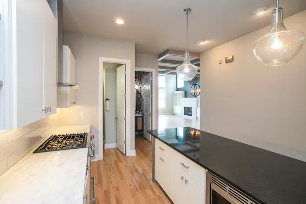 a kitchen with a sink and refrigerator