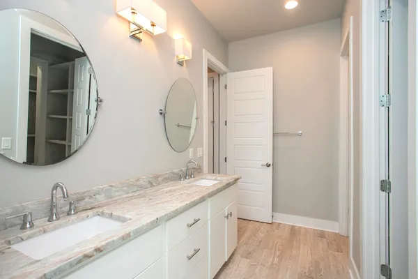 a view of walk in closet with empty racks