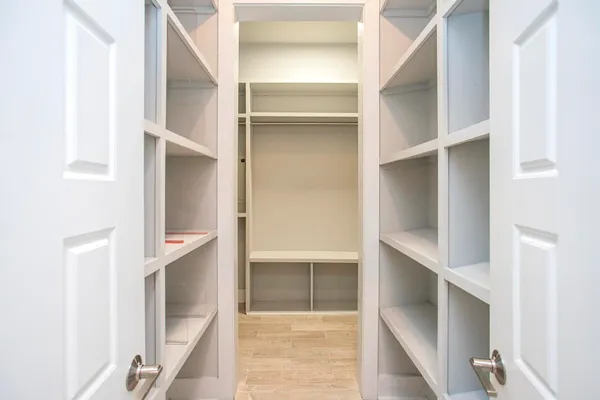 a view of an empty room and a window