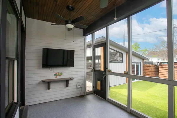 a view of an empty room with a window