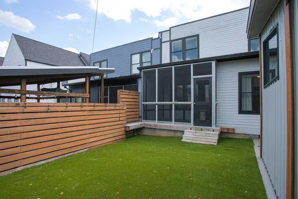 a backyard of a house with lots of green space