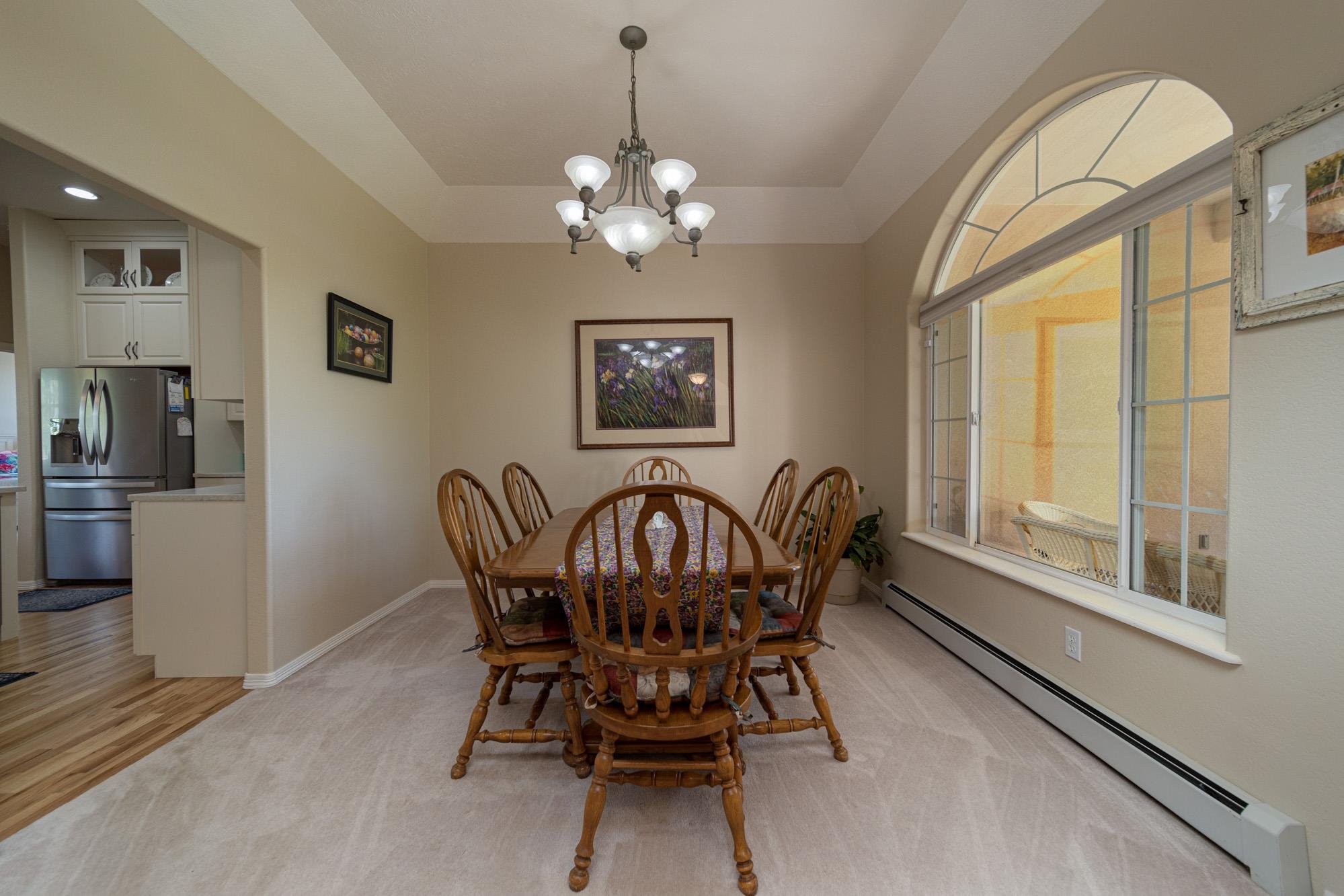 1668 M Road Fruita, CO 81521 - Photo 7 of 34 a view of a dining room with furniture window and wooden floor