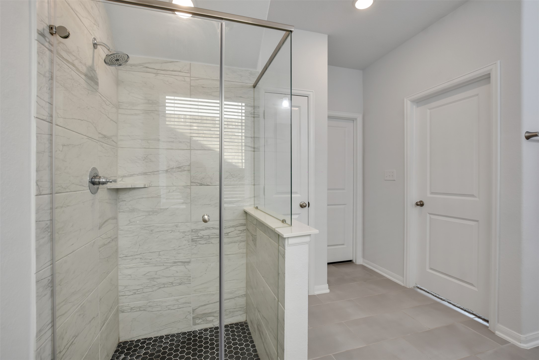 605 Oleander Loop Buda, TX 78610 - Photo 16 of 32 a bathroom with a shower and a sink
