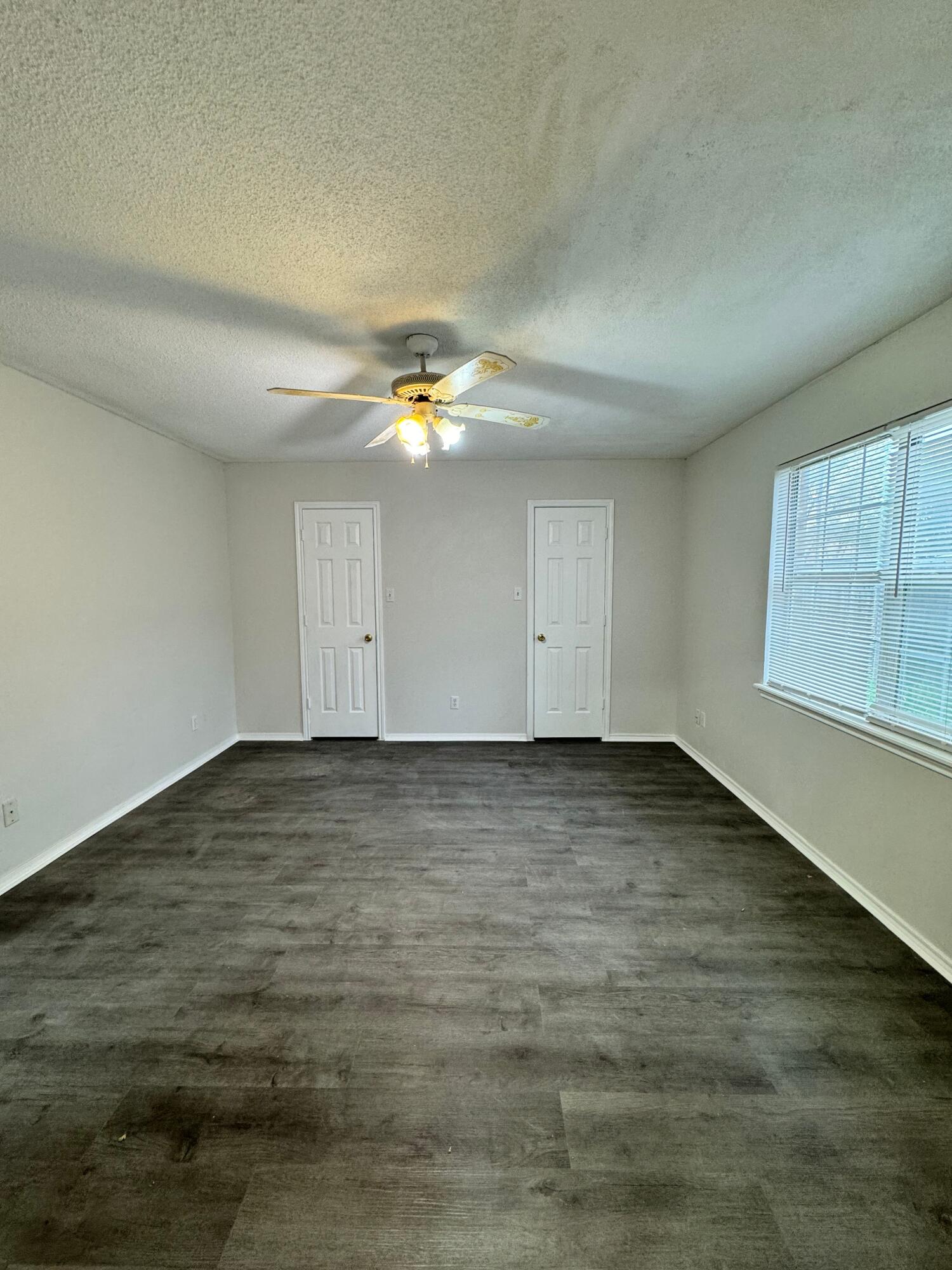 4411-2 Kemper Street Lubbock, TX 79416 - Photo 11 of 14 an empty room with a empty space and window