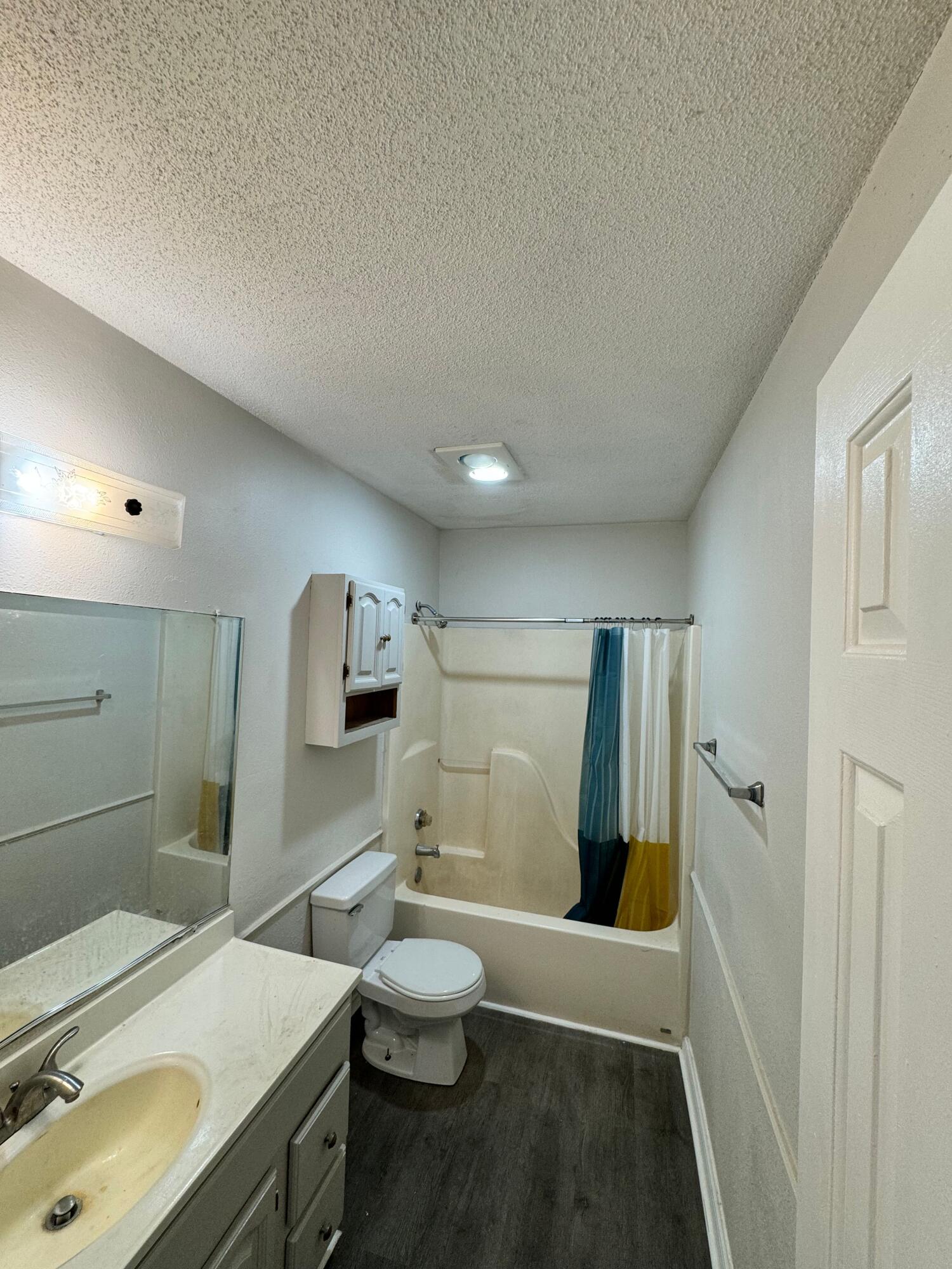 4411-2 Kemper Street Lubbock, TX 79416 - Photo 8 of 14 a bathroom with a sink toilet and shower