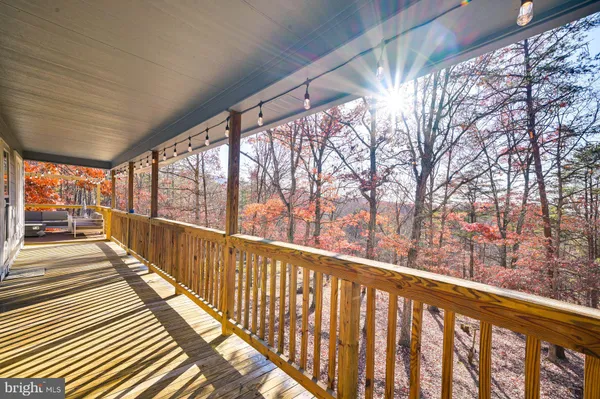 a view of balcony with wooden floor