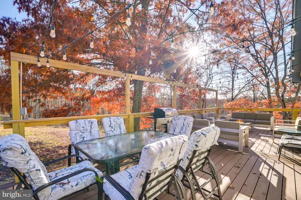 a view of yard from terrace with seating space