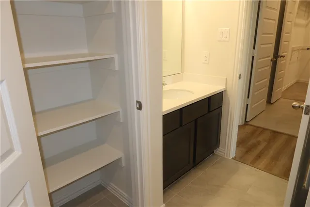 a bathroom with a shower and a sink