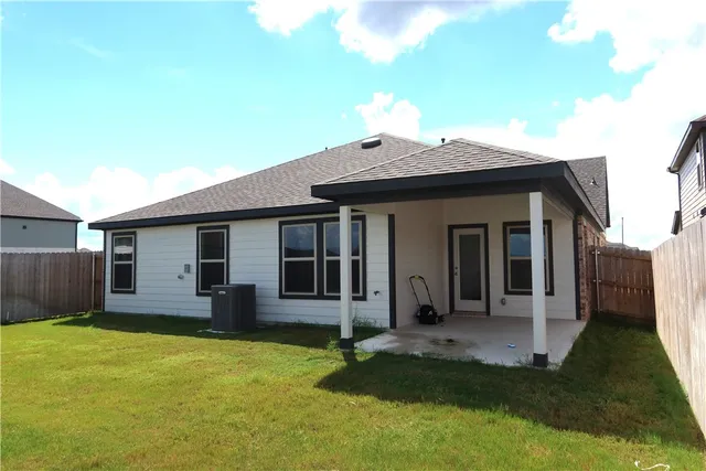 a view of a house with backyard porch and wooden floor