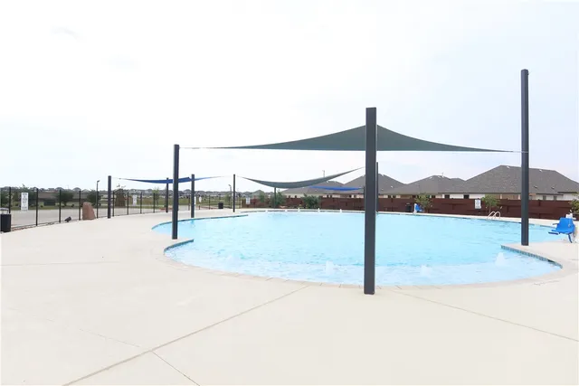 a view of outdoor space with swimming pool