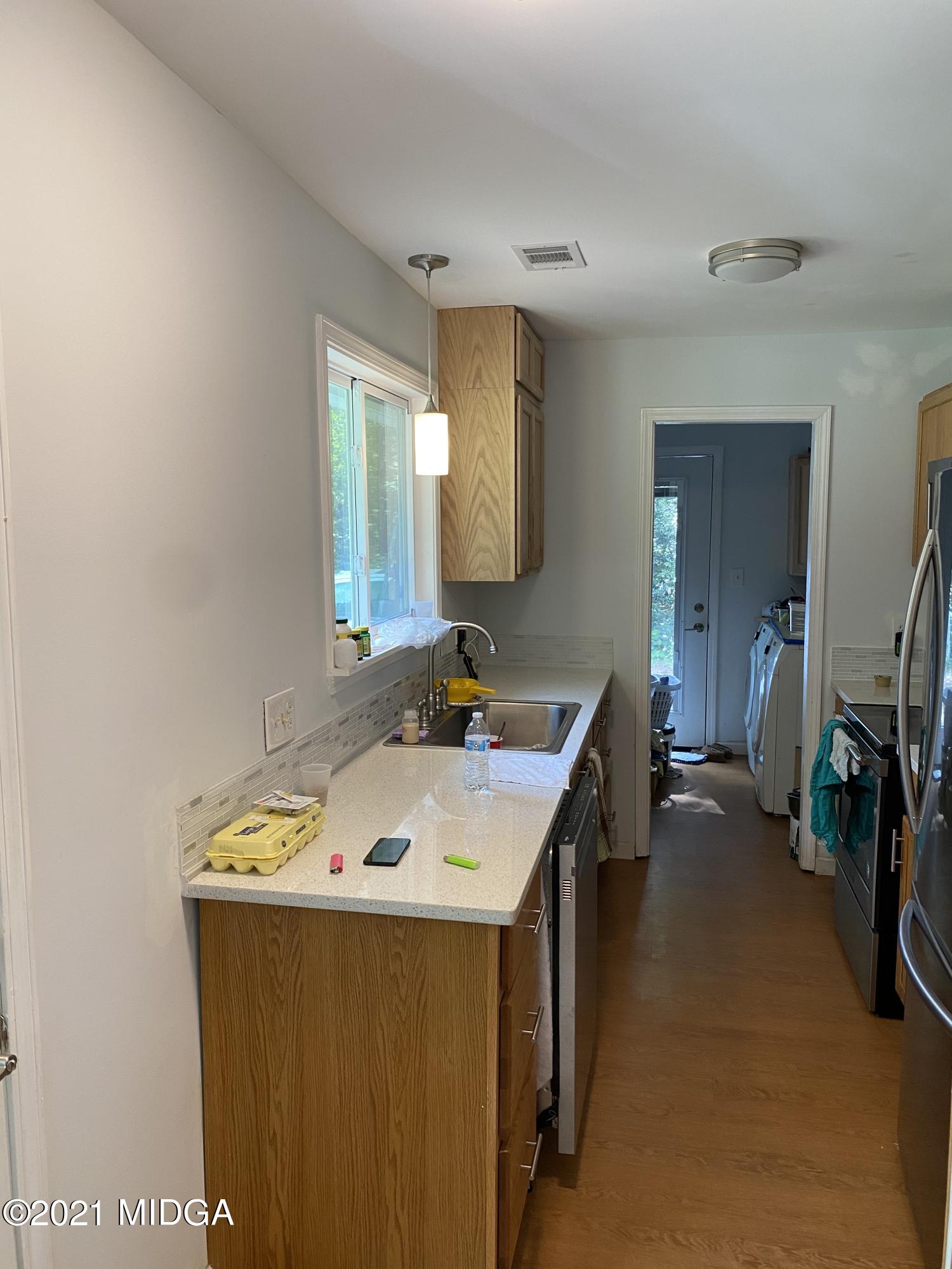 1351 Taylor Road Juliette, GA 31046 - Photo 2 of 14 a bathroom with a sink a vanity and a mirror