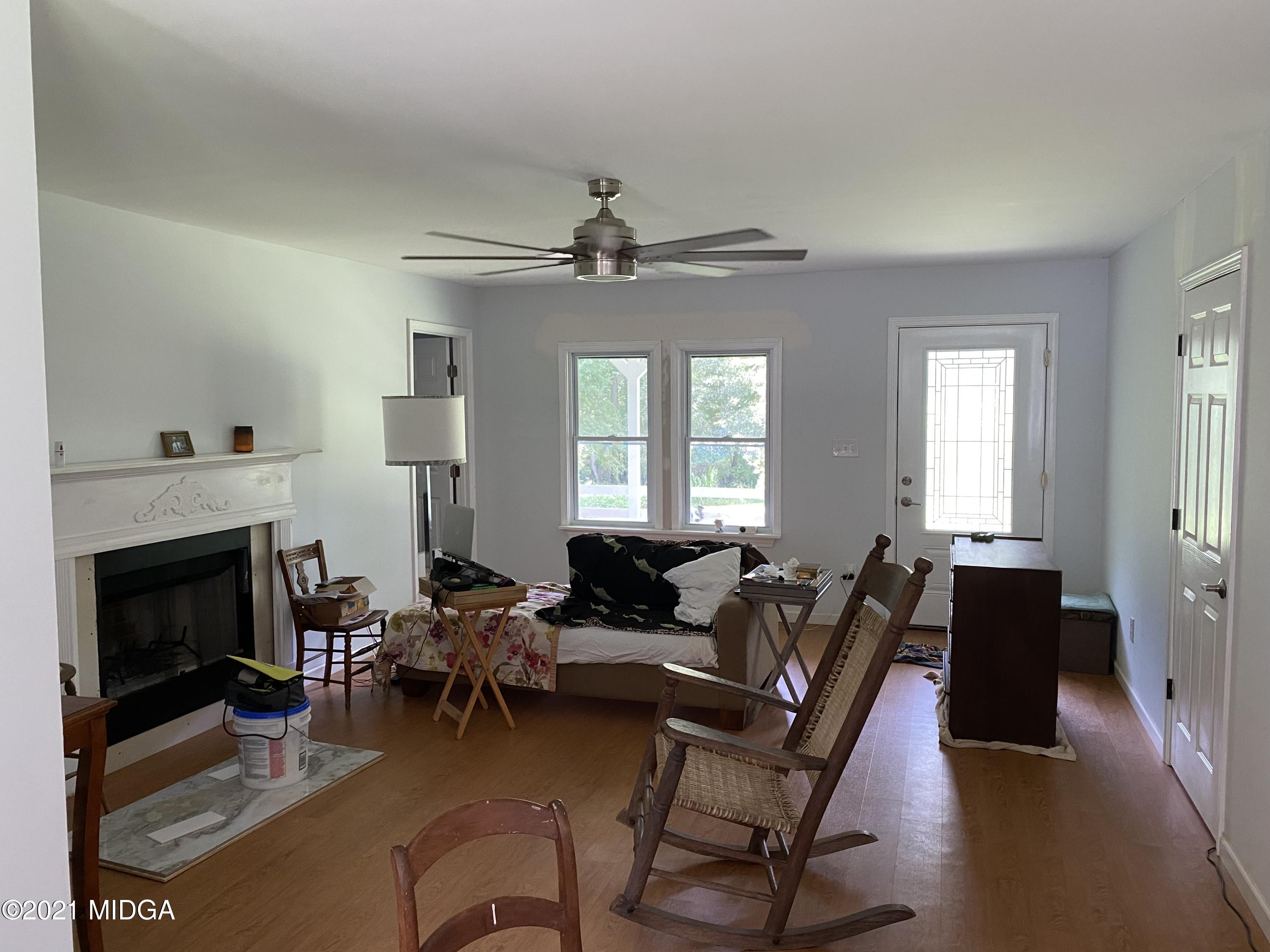 1351 Taylor Road Juliette, GA 31046 - Photo 3 of 14 a living room with furniture a fireplace and a window