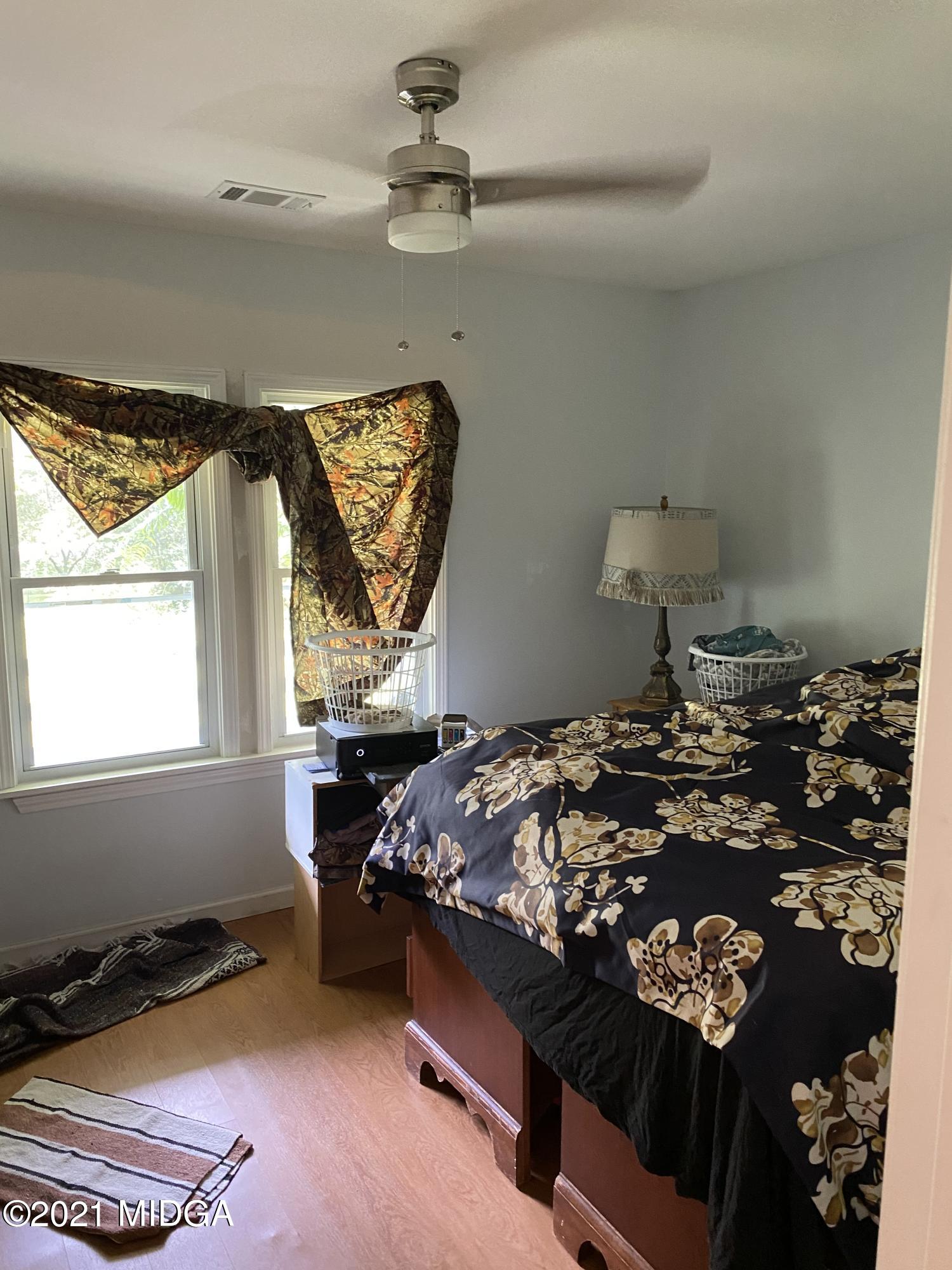 1351 Taylor Road Juliette, GA 31046 - Photo 4 of 14 a bed sitting in a bedroom next to a window