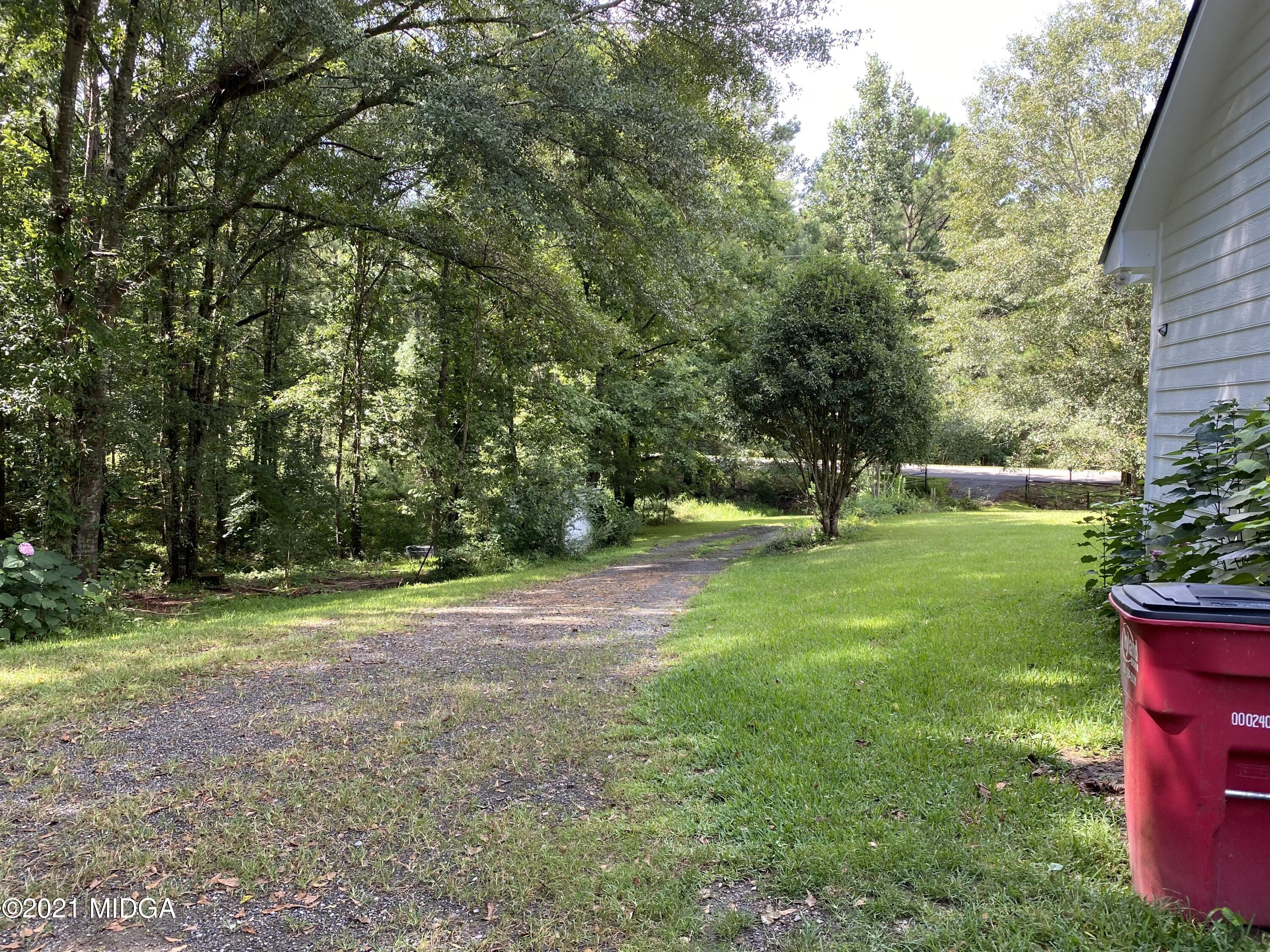 1351 Taylor Road Juliette, GA 31046 - Photo 9 of 14 a view of a backyard with large trees
