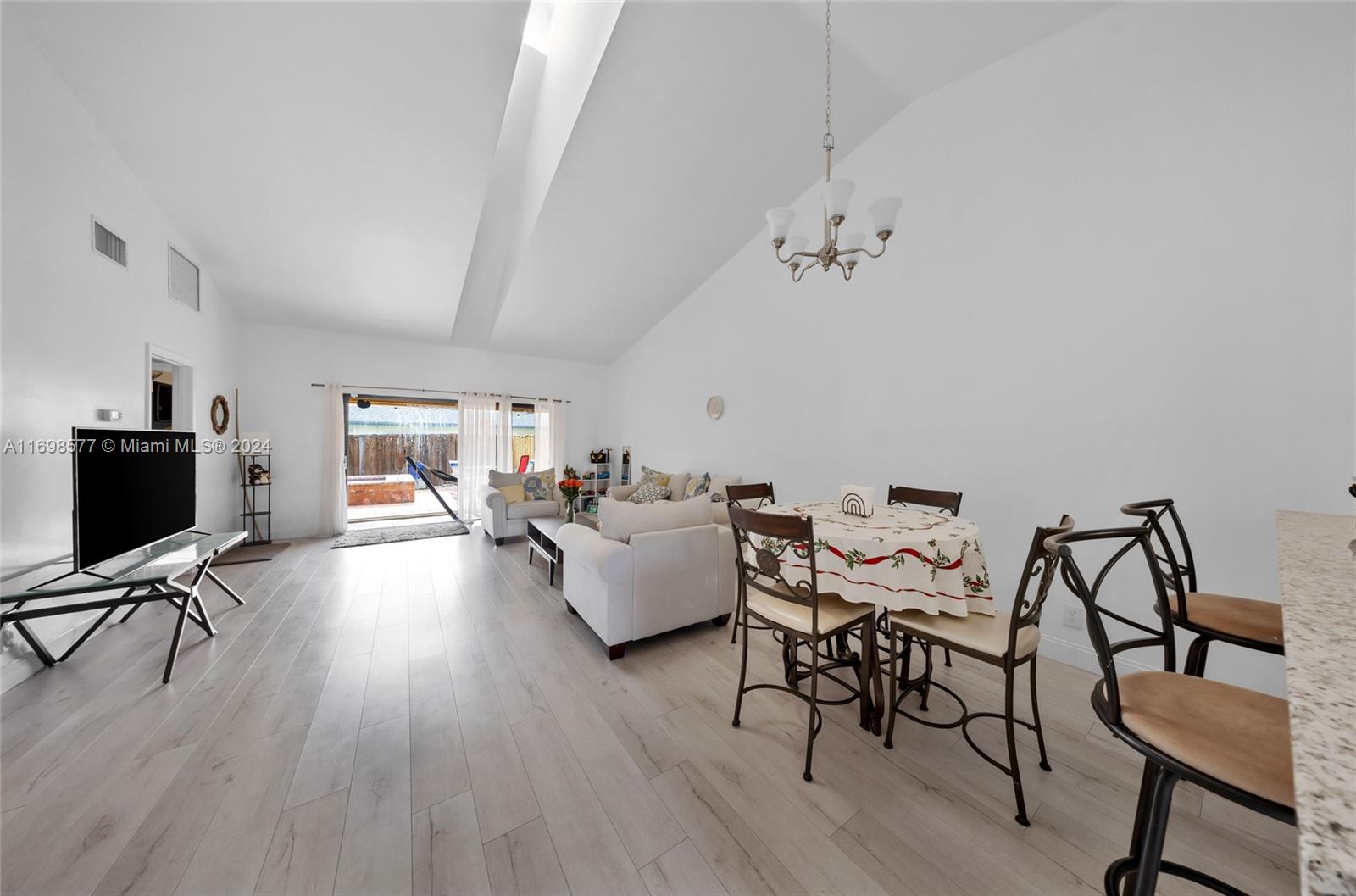 4440 Northeast 5th Avenue Boca Raton, FL 33431 - Photo 11 of 50 a living room with furniture and wooden floor