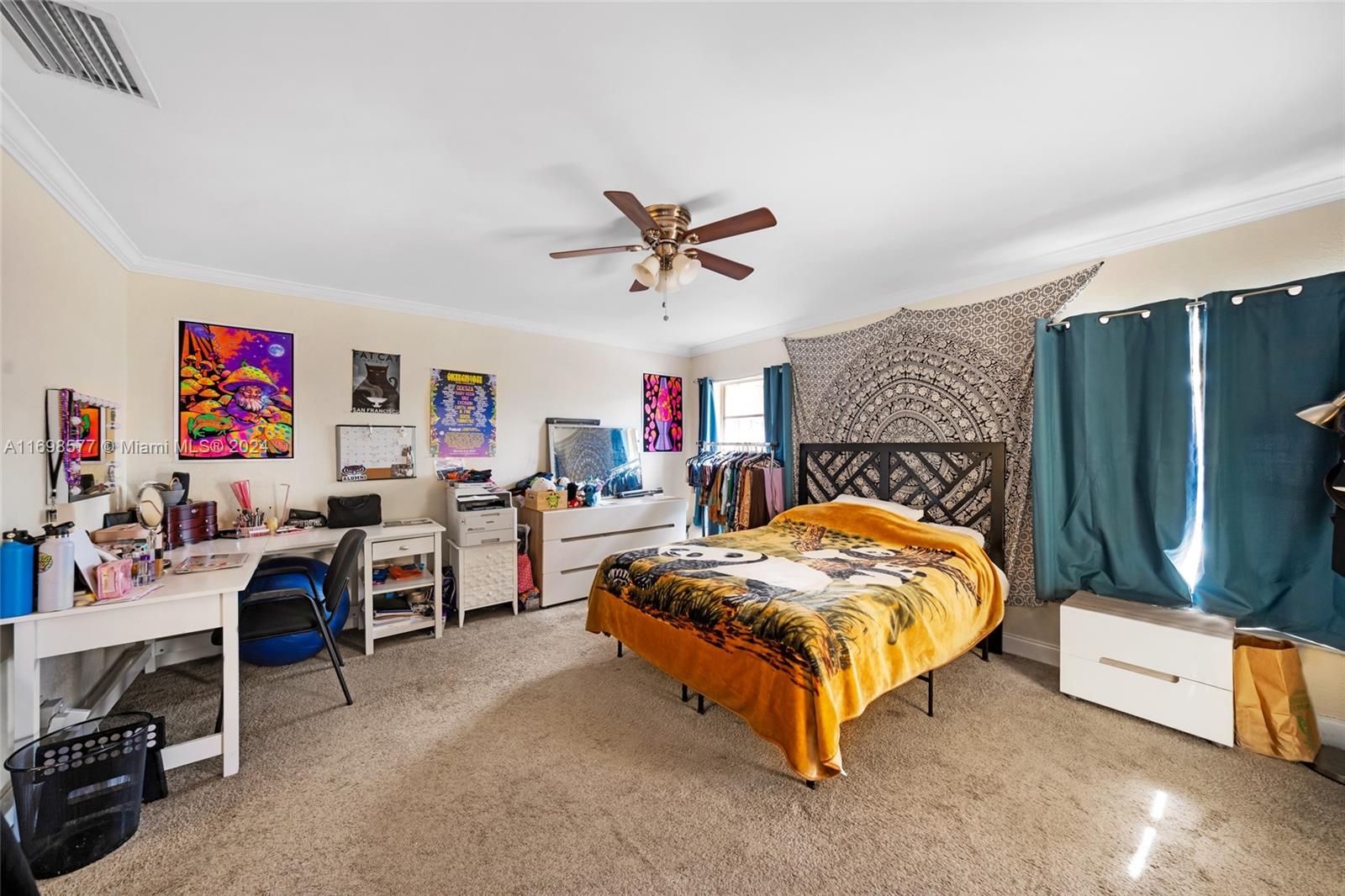 4440 Northeast 5th Avenue Boca Raton, FL 33431 - Photo 23 of 50 a bed room with a bed and a desk