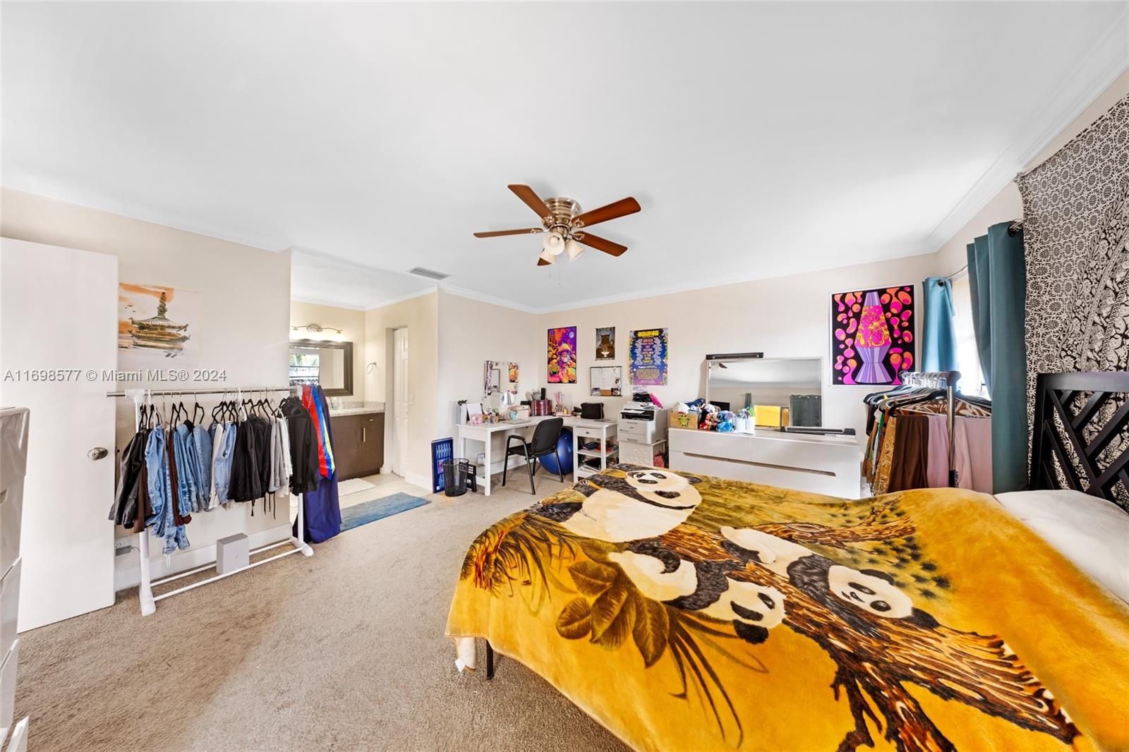 4440 Northeast 5th Avenue Boca Raton, FL 33431 - Photo 24 of 50 a bed room with a bed and a flat screen tv