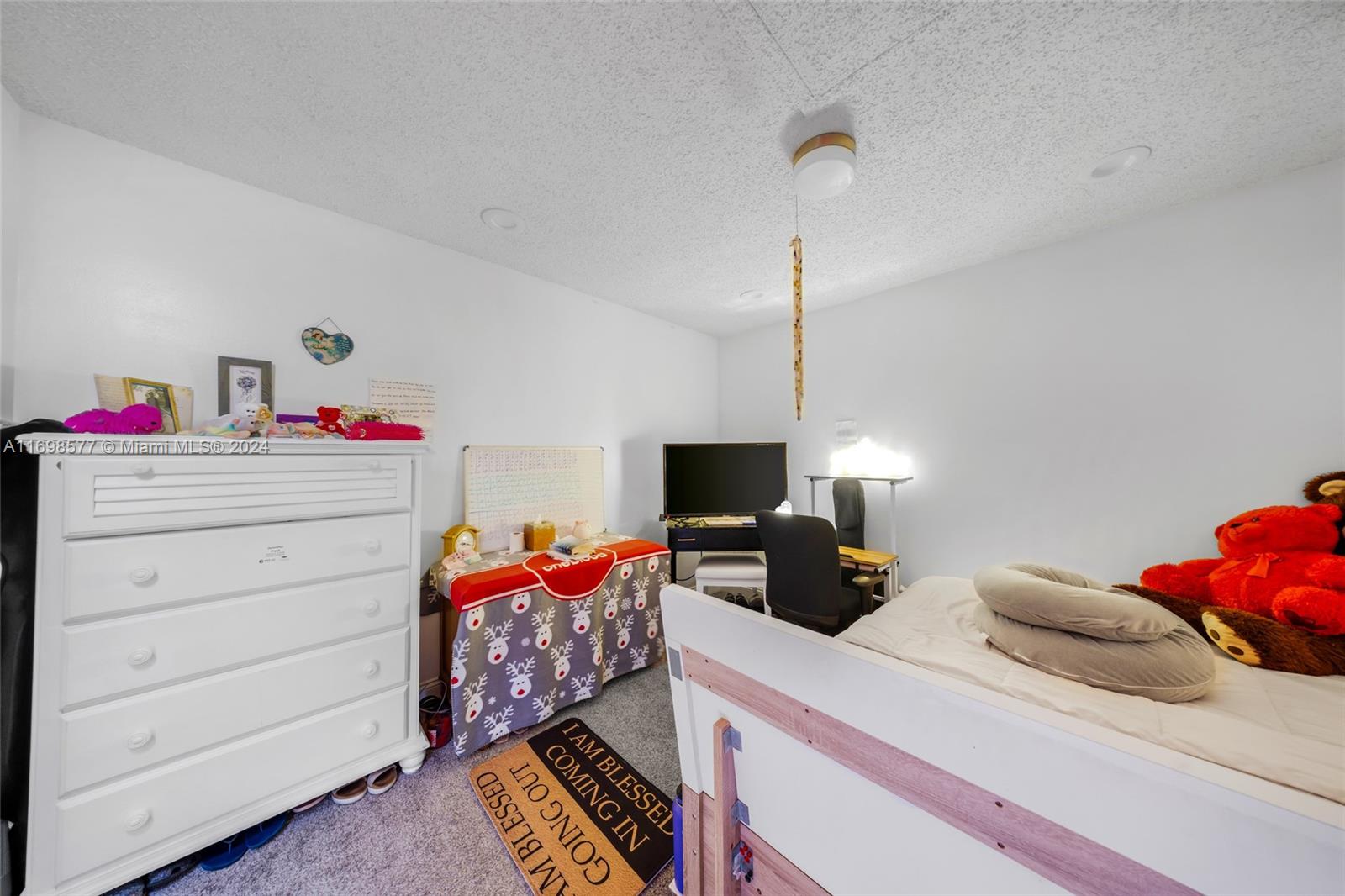 4440 Northeast 5th Avenue Boca Raton, FL 33431 - Photo 29 of 50 a bedroom with a bed and wooden floor